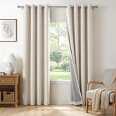 100% Blackout Shield beige curtains in a bedroom setup for deep rest