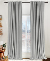 100% Blackout Shield backtab curtains block light for a darker bedroom.