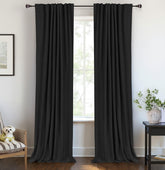 100% Blackout Shield linen curtains in a dark bedroom offer total light control.