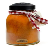 A Cheerful Giver orange cinnamon clove candle close-up showing glass jar for home fragrance.