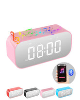 AFK alarm clock with Bluetooth speaker beside bed and mirror LED display for easy night viewing