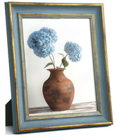 Afuly blue and gold 8x10 vintage frame on wall, enhances heirloom photos