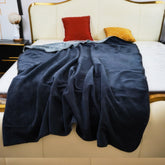 Ahinahwap waterproof blanket on bed and couch with dual-faced protection.