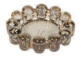 Alice Lane Original Bubble Candle Dish in smoky glass elevates small votives with chic style.