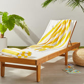 Amazon Basics cabana stripe yellow towel folded, 30x60, plush and absorbent for beach days.