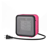 Amazon Basics ceramic space heater on a desk showing compact design for small spaces