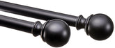 Amazon Basics curtain rod with round finials extends to fit various window widths.