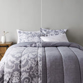 Amazon Basics king-size ultra-soft microfiber reversible comforter with gray medallion for cozy warmth.