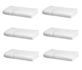 Amazon Basics premium cotton bath mat 20x30 in white, soft and highly absorbent for guest bathrooms.