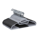 Amazon Basics space-saving hangers with 360-degree swivel keep shirts and jackets neatly arranged.