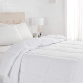 Amazon Basics white down-alternative twin comforter for light all-season warmth.