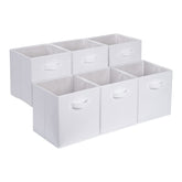Amazon Basics collapsible storage bins arranged on a shelf for tidy organization.