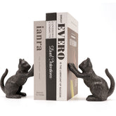 Ambipolar cat decorative bookends holding books securely on a shelf.