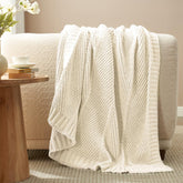 AmΓ©lie Home knit throw blanket soft-chenille-ivory provides cloud-like comfort for any sofa.