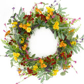 AMF0RESJ artificial spring wreath on front door with yellow daisies and olive leaves.