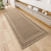 AMOAMI waffle bath mat in beige with absorbent texture for dry bathroom floors.