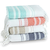 Amudeshi 4-pack cotton Turkish beach towels folded for travel.
