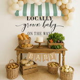 Amyhill green and white striped canopy for a fresh baby shower backdrop