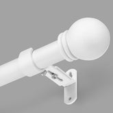 AMZSEVEN curtain rod with adjustable length shown on a window for a precise fit