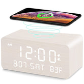 Andoolex wooden alarm clock with wireless charging on nightstand keeps your phone powered while you sleep.