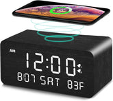 Andoolex wooden digital alarm clock with wireless charging on bedside table