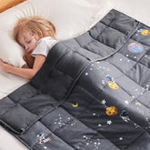 Anfie kids weighted blanket with astronaut design in space-grey calms bedtime with gentle pressure