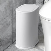 Anzoymx slim bathroom trash can fits tight spaces.