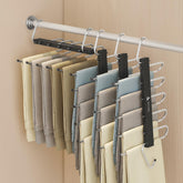 AOCTFIRST 4-pack pants hangers in a compact closet setup for organized space.