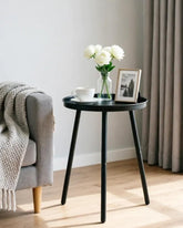 AOJEZOR round-top side table with three legs, matte black finish, ideal for tight spaces.