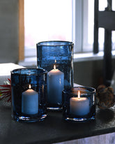 ARIAMOTION glass hurricane candle holder in blue seeded bubbles adds ambient dining room glow