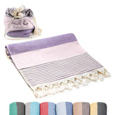 ATANI Turkish Beach Towel laid flat in lavender for comfortable lounging on the sand.