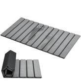 AWW foldable stone bath mat with quick-dry surface on tile floor