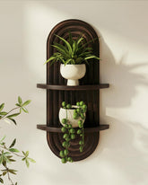 Bamworld boho arched wall decor shelf in walnut, ideal for displaying small plants.