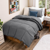 Bare Home Twin XL Grey comforter set folded, showcasing soft, inviting fabric.