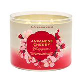 Bath & Body Works Japanese Cherry Blossom 3-Wick Candle jar releases floral fragrance into the room.