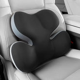 BEBAS lumbar support pillow on car seat with ergonomic contour for comfort.