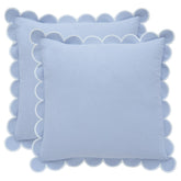 Bebe Bask blue scalloped pillow cover set on sofa adds timeless charm