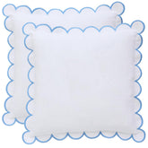 BEBE BASK Margot scalloped pillow cover in white and blue enhances living room décor.