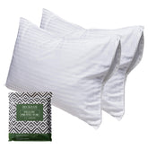 Beckham Hotel Collection four-pack pillow protectors laid on bed protect pillows from dust and wear.