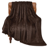 BEDELITE brown fleece blanket folded on a couch for cozy evenings.