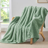 BEDELITE fleece green throw blanket on couch for cozy relaxation