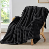 BEDELITE striped fleece blanket on couch delivers soft warmth for cozy evenings.