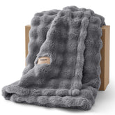 Bedsure 3D fleece bubble blanket on couch highlights cozy texture.