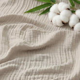 Bedsure cooling muslin blanket on king bed, showcasing cool night comfort