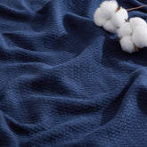 Bedsure GentleSoft 100% Cotton blanket in navy herringbone, soft and breathable for everyday use.