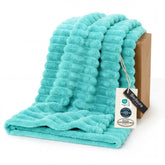 Bedsure GentleSoft Blue Fog blanket on couch for cozy evenings.