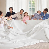 Bedsure Gentlesoft cotton blanket on white bed for yearβround comfort