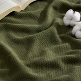 Bedsure GentleSoft cotton throw front view in olive green highlights breathable fabric
