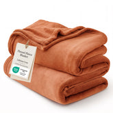 Bedsure GentleSoft fleece blanket on a bed, premium warmth and plush softness