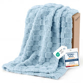 Bedsure GentleSoft light blue throw on sofa provides cozy warmth for evenings.